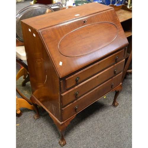 419 - A 1940's mahogany bureau, fall front over three drawers, cabriole legs, ball and claw feet