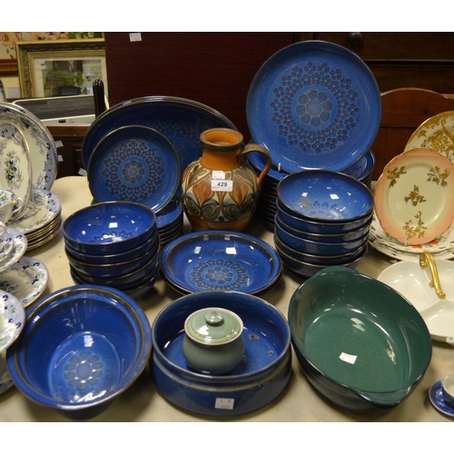 429 - A Denby Midnight part dinner service comprising dinner plates, side plates, dessert bowls, serving p... 