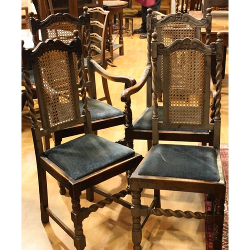 434 - A set of four Jacobean Revival oak dining chairs, comprising two side chairs and a pair of carvers