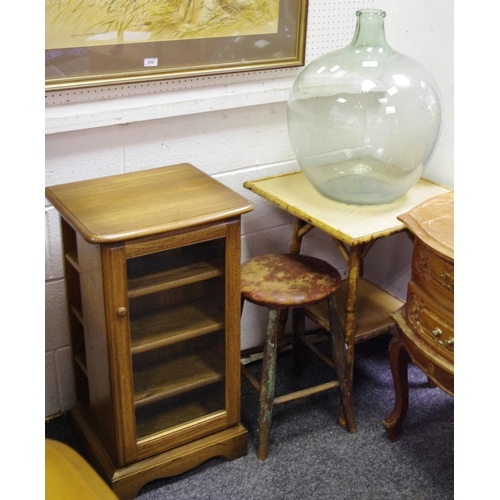 439 - A glass carboy; a bamboo occasional table; an oak stool (3)