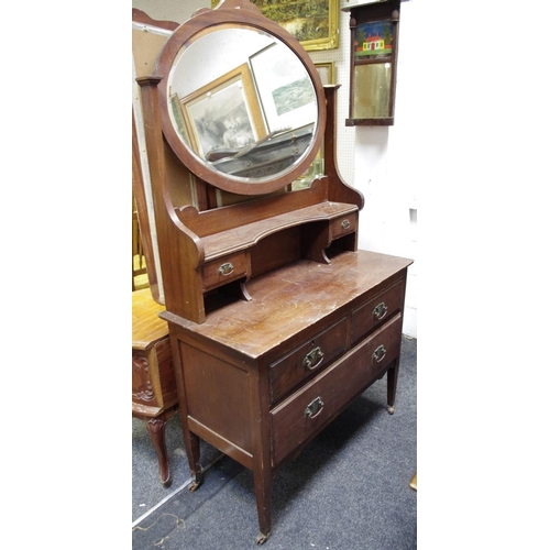 440 - A mahogany dressing chest, oval mirror, shelf and two drawers to superstructure, two short drawers o... 