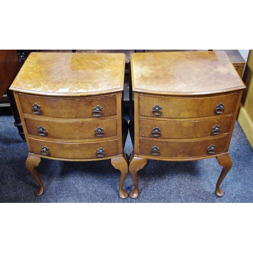 452 - A pair of reproduction walnut veneered bow front bedside chests, three drawers, cabriole legs, club ... 