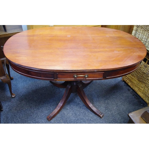 455 - A reproduction mahogany oval table, fitted with drawers