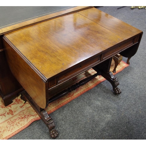 476 - A mahogany sofa table, cross banded top, two short drawers to frieze, carved end supports, turned st... 