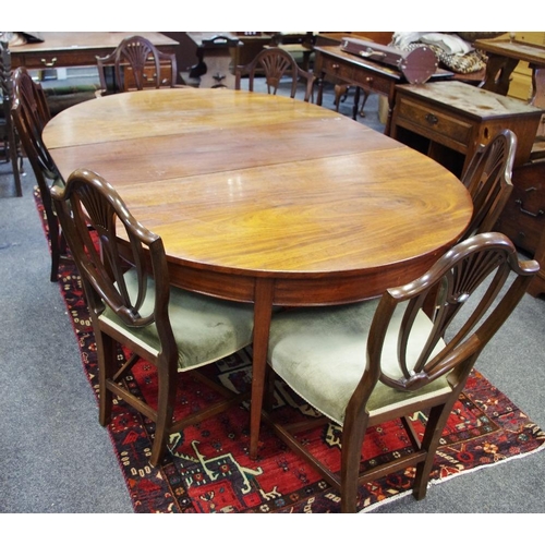 477 - A George III mahogany D-end dining table (one associated leaf); a shield back carver and five confor... 