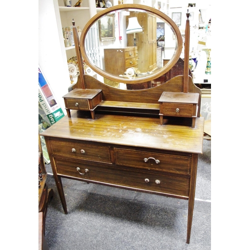 488 - An Edwardian mahogany dressing chest, oval mirror and two drawers to top, two short drawers over one... 