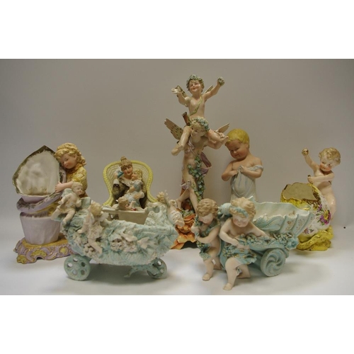 53 - A German figural candlesticks,  of a child being carried by a maiden, c.1890;  a German bisque table... 