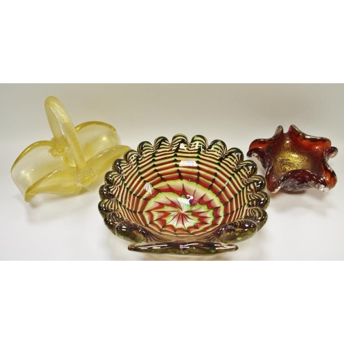 73 - Art Glass - a large shell shaped dish, sworls of red, greens and gold; a glass basket with gold flec... 