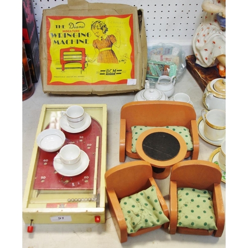 91 - The BCM The Diane miniature Wringing Machine, boxed; a child's tea service;  a wooden three piece su... 