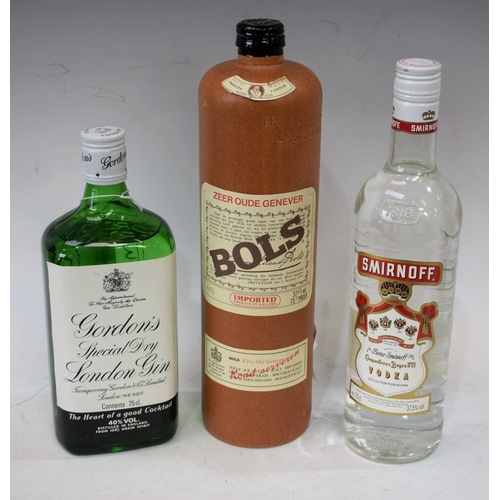 57 - A bottle of Bols Genever, 1ltr; a bottle of Gordon's gin, 75cl; a bottle of Smirnoff vodka, 70cl (3)