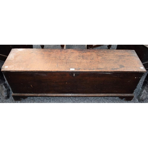 7 - A late 18th century oak 'sword chest', hinged top, skirted base, bracket feet, 131.5cm wide