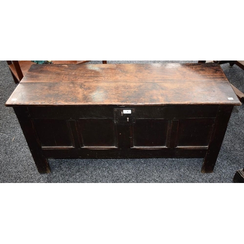 9 - An 18th century oak chest, rectangular top above a four panel front, 113cm wide