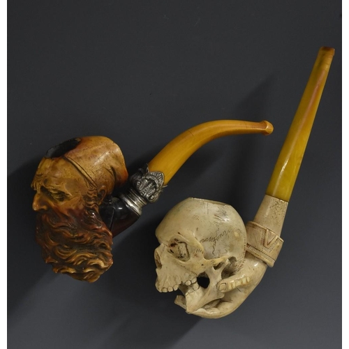 3073 - A 19th century meerschaum pipe, carved as the head of a bearded gentleman wearing a cap, 15cm long; ... 