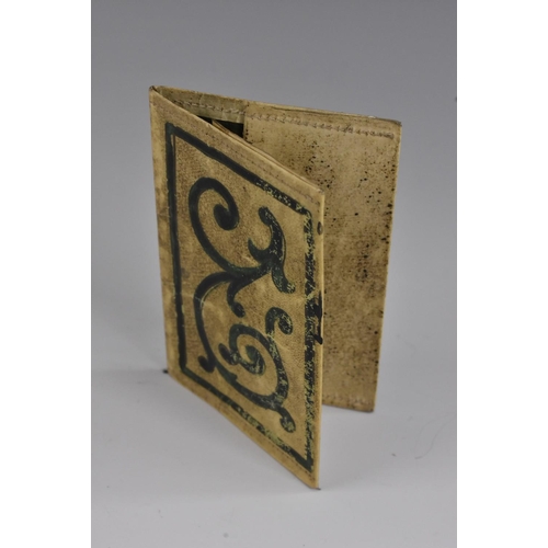 3225 - A mid-18th century vellum wallet or sleeve, each cover of the 'binding' scrivened and illuminated in... 