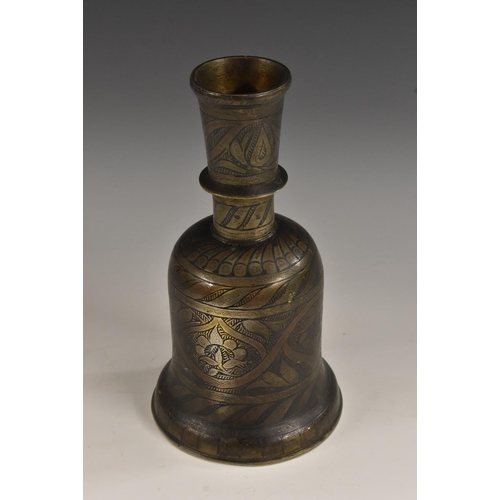 3230 - A Middle Eastern dark patinated bronze hookah base, chased and decorated in the Islamic taste, trace... 