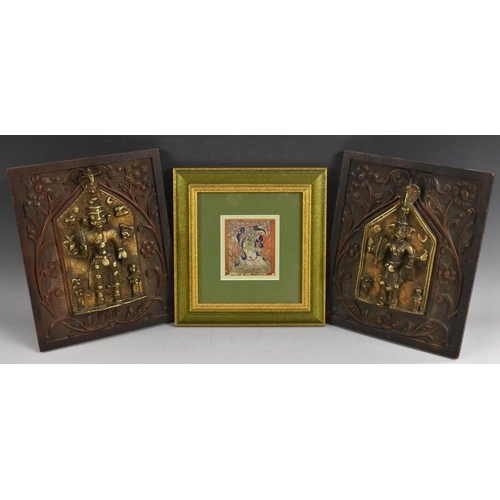 3243 - A near pair of Indian gilt-patinated bronze figural panels, each cast with an armed deity beneath a ... 