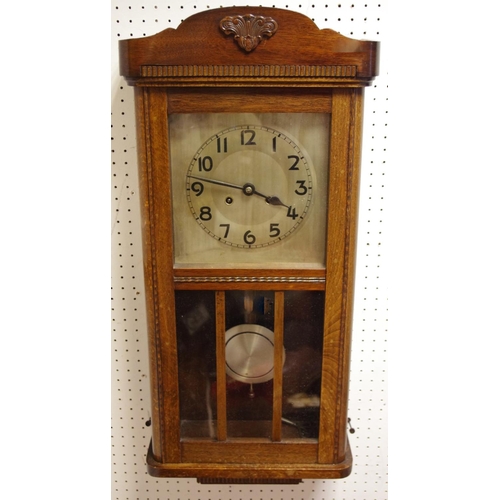 104 - A early-mid 20th century oak cased wall clock