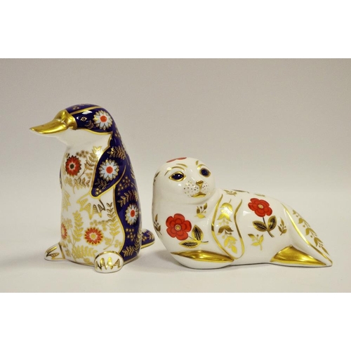 19 - A Royal Crown Derby paperweight Platypus, printed marks to base, gold stopper; sea lion (2)