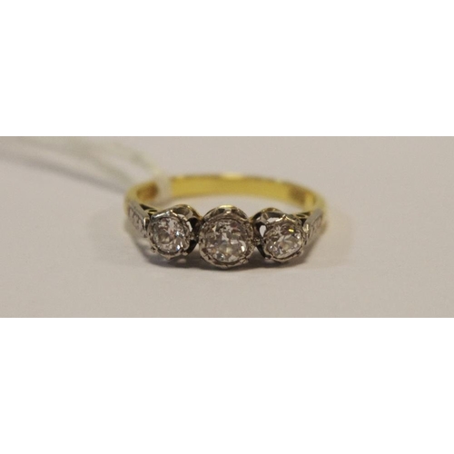 257A - A lady's diamond three stone ring, old cut stones, 18ct gold shank