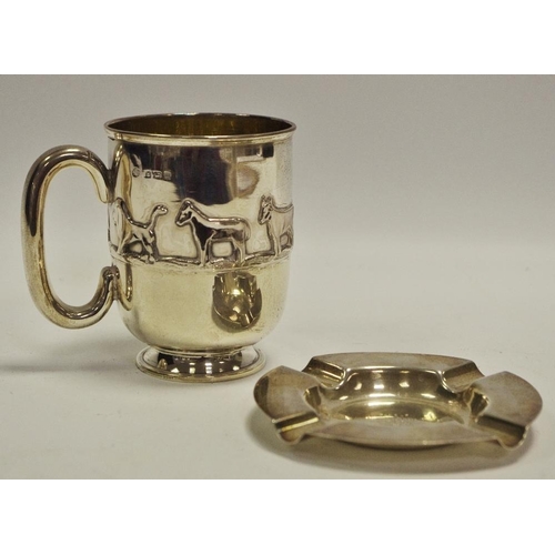 304 - A silver beaker embossed in relief with animals, gilded interior dated 1911 92g; silver presentation... 