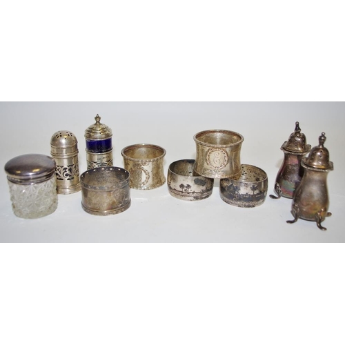 321 - A pair of silver pepper pots, 7.52cm high, Birmingham 1912;  a napkin rings;  a salt and pepper;  a ... 