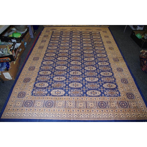 378 - A middle eastern rectangular rug, all over decorated with geometric panels, blue ground, approx 300c... 