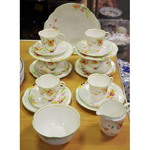 392A - An Art Deco tea set for six, printed with summer flowers, c.1938