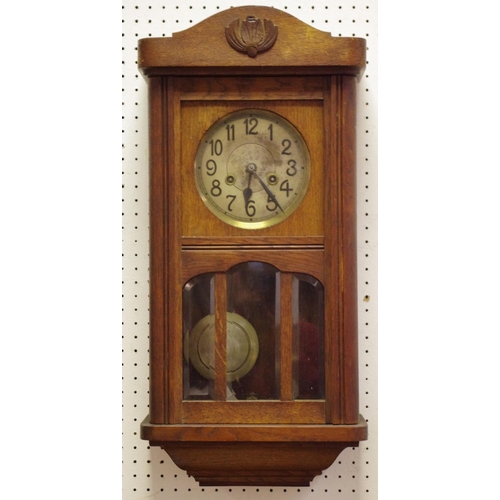 425 - An early 20th century oak wall clock, c.1930