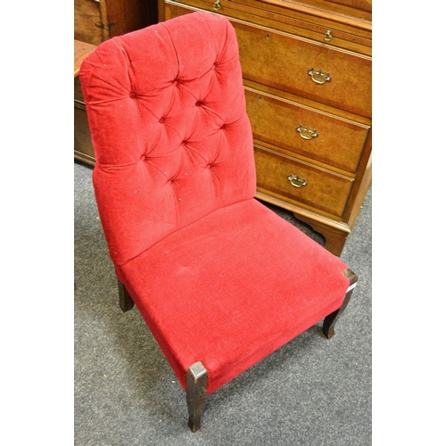 430 - A 1920's oak nursing chair. button back, padded seat.