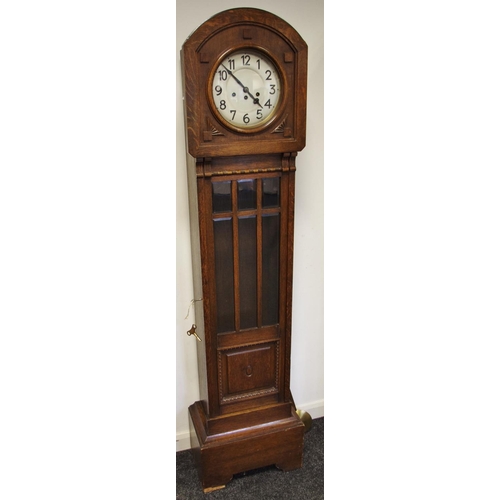 432 - A 1930/40's oak grandmother clock, silvered dial, Arabic numerals, three bevel edge glass panels to ... 