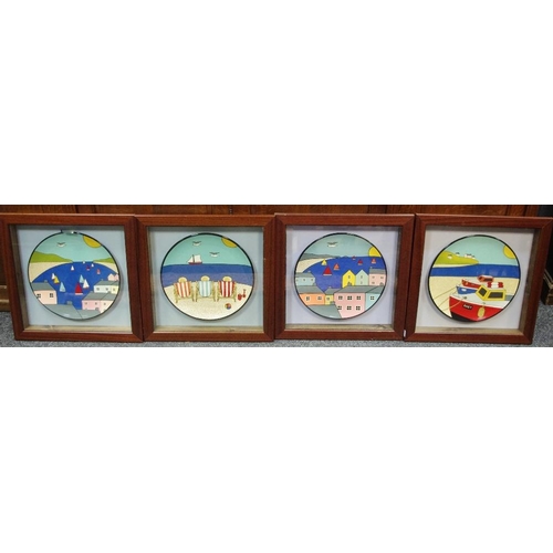 440 - A set of four colourful coastal scene cabinet plates dioramas, housed in display cases depicting har... 