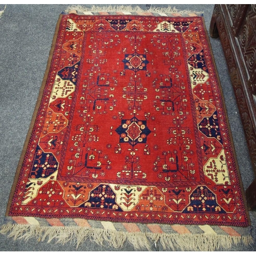 447 - A Persian woollen rug, 124cm x 184cm; another (2)