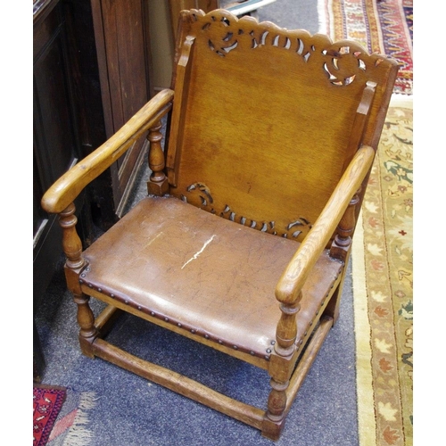 451 - A 20th century oak Monk's chair, leatherette seat, c.1930