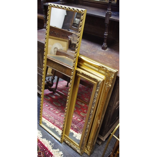 467 - A gilt framed wall mirror, swept frame, bevelled glass, approximately 65cm x 91cm; another , similar... 