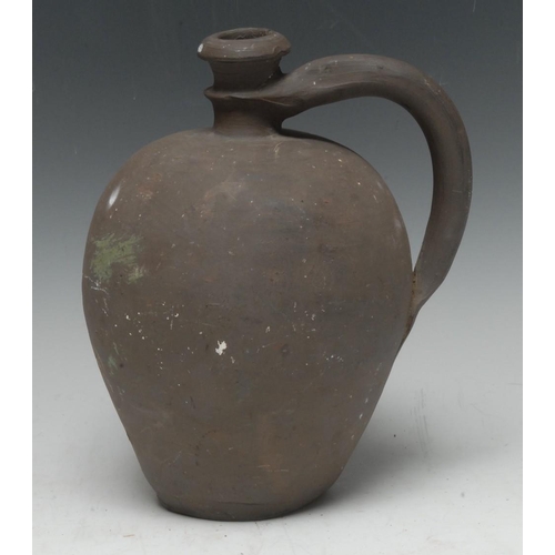 3756 - Antiquities - a post-Medieval earthenware ovoid ale jug, loop handle, 23cm high, (later restoration)