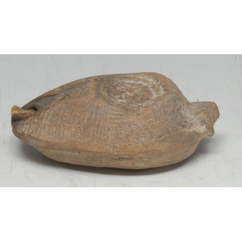 3757 - Antiquities - an ancient Middle-Eastern terracotta oil lamp, naively moulded in shallow relief as a ... 