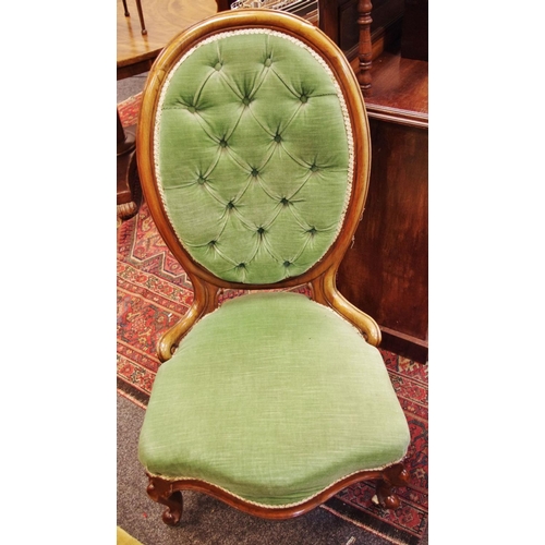 507 - A Victorian mahogany spoon back nursing chair, button upholstered back, serpentine padded seat, knur... 