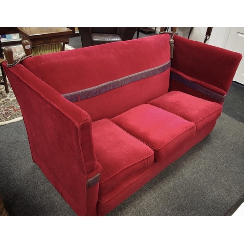 521 - An early 20th century three seater Knowle sofa, scarlet upholstery