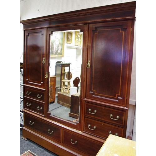 528 - An Edwardian mahogany triple wardrobe, dental ogee cornice above  fielded panelled satinwood inlaid ... 