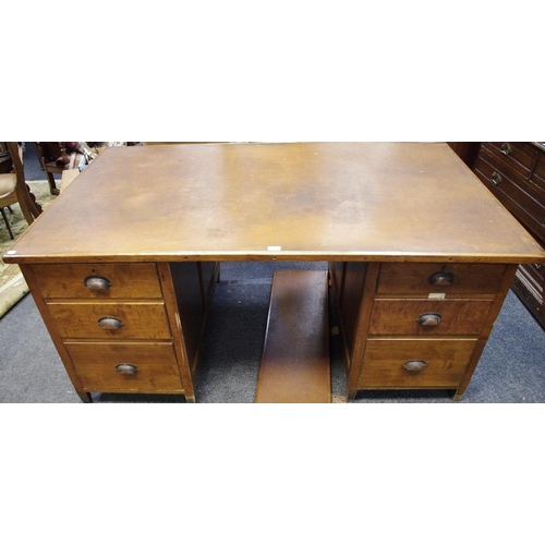 531 - A large early 20th century oak partners desk, leather inlaid top each pedestal holding storage to ei... 