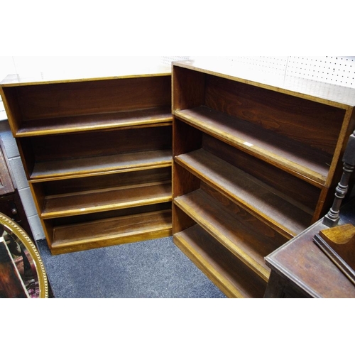 537 - Two oak four tier stacking bookcases.