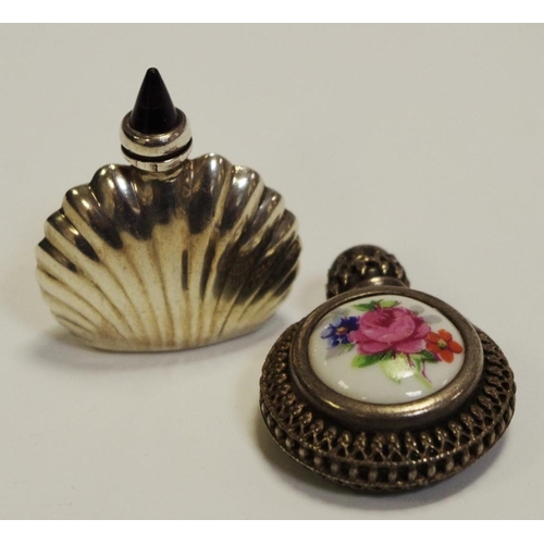 43 - A silver coloured metal shell shaped scent bottle; a porcelain mounted scent bottle (3)