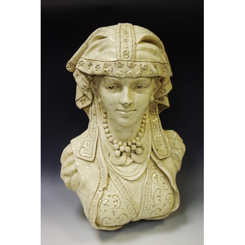 21 - An early 20th century pottery wall bust, of a Romany Lady, cream crackle glaze, 40cm long