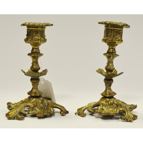 22 - A pair of 19th century gilt metal candlesticks