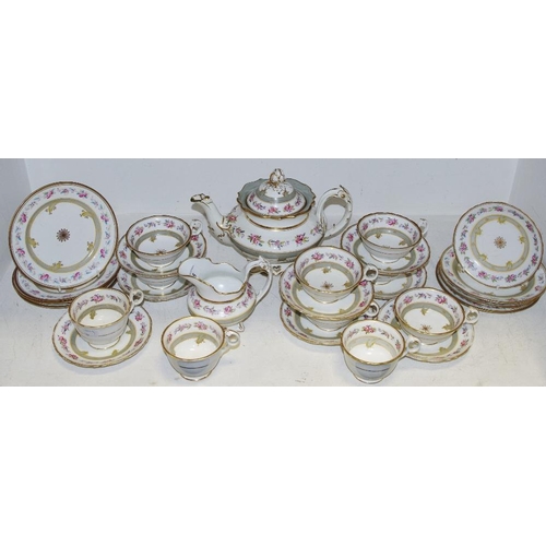 45A - An early 19th century tea service, comprising teapot, seven large cups, four smaller cups, eight sau... 