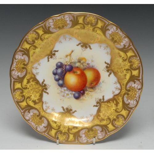 141 - A Royal Worcester shaped circular cabinet plate, painted by John Freeman, signed, with ripe apples a... 