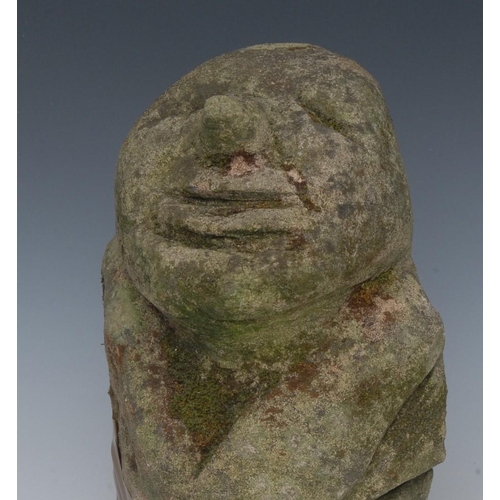 1449 - A 19th century grit stone stone corbel, of a grinning face, 34cm high