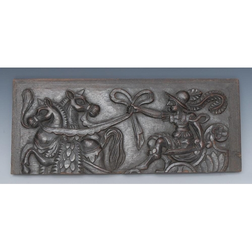 1451 - A 17th century Baroque oak rectangular panel, carved in relief with an armored charioteer, grasping ... 