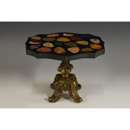 1461 - A Grand Tour type pietra dura and gilt bronze miniature table, the shaped oval top inlaid in malachi... 