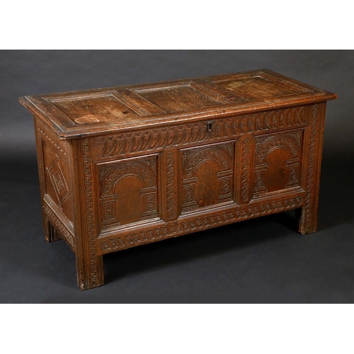 1463 - A 17th century oak three panel blanket chest, hinged top, carved front, 67cm high, 120cm wide, c.168... 